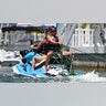 Sydney Sweeney on the back of a jet ski