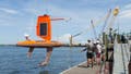 A robotic drone being lowered into the water - Fox News