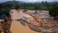 Rescuers on their second day of mission following Tuesday&rsquo;s landslides cross a river at Chooralmala, Wayanad district, Kerala state, India, Wednesday, July 31, 2024. - Fox News