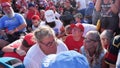 BUTLER, PENNSYLVANIA - July 13: Members of the crowd duck under chairs after former president Donald Trump is assisted offstage during a campaign rally at Butler Farm Show Inc. on Saturday, July 13, 2024 in Butler, Pa. Trump ducked and was taken offstage after loud noises were heard after he began speaking. 
(Photo by Jabin Botsford/The Washington Post via Getty Images)