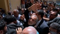 Reformist candidate for the Iran's presidential election Masoud Pezeshkian waves as he arrives to vote at a polling station in Shahr-e-Qods near Tehran, Iran, on July 5, 2024.