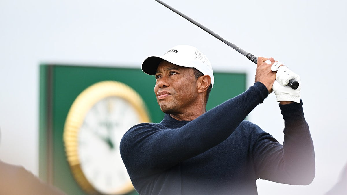 Tiger Woods tees off