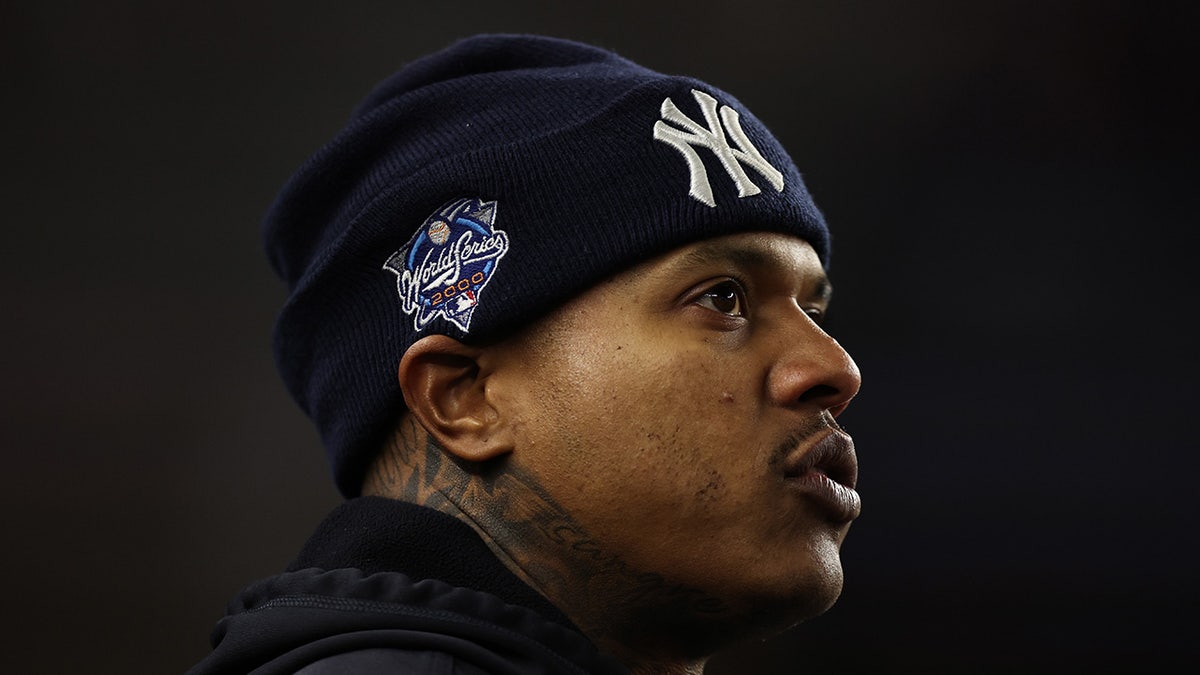 Marcus Stroman looks on from the dugout