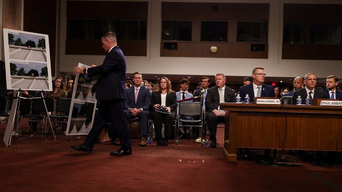 images being put on display during a Senate hearing as Ronald Rowe Jr. and Paul Abbate testify