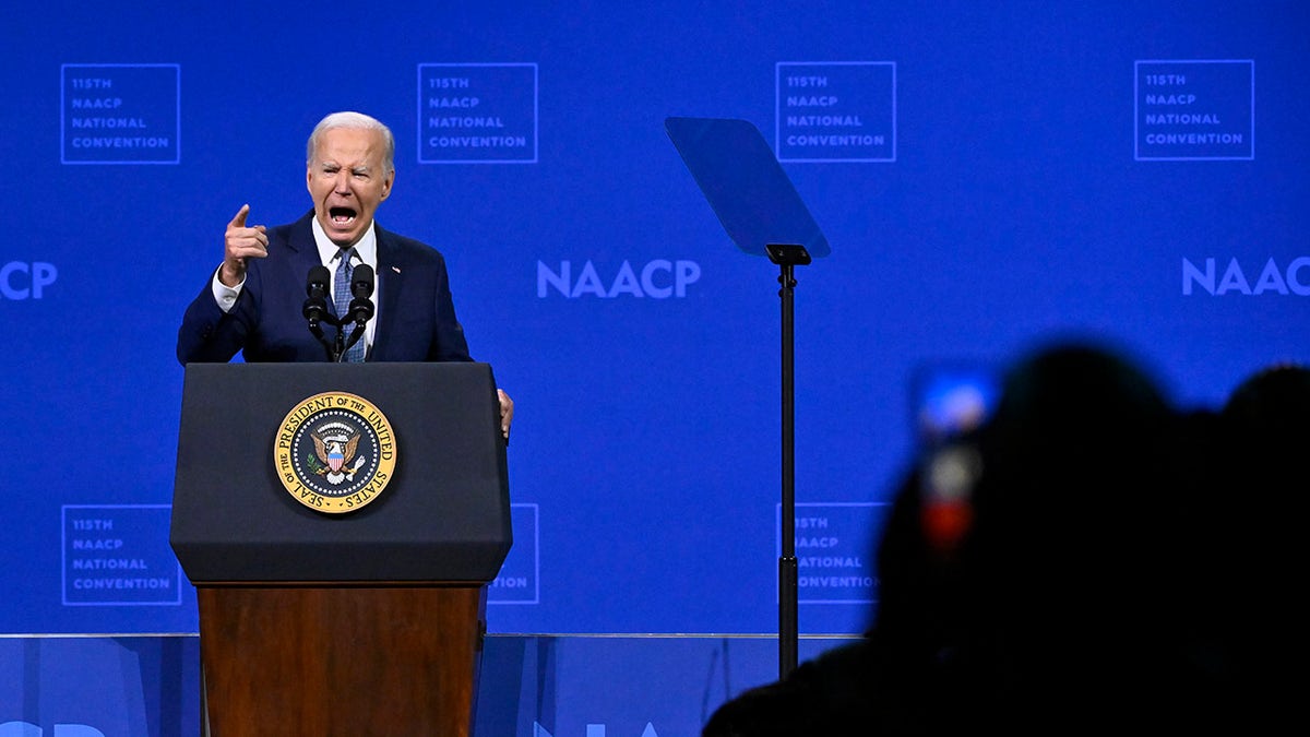 Biden on stage speaking to Las Vegas NAACP national convention