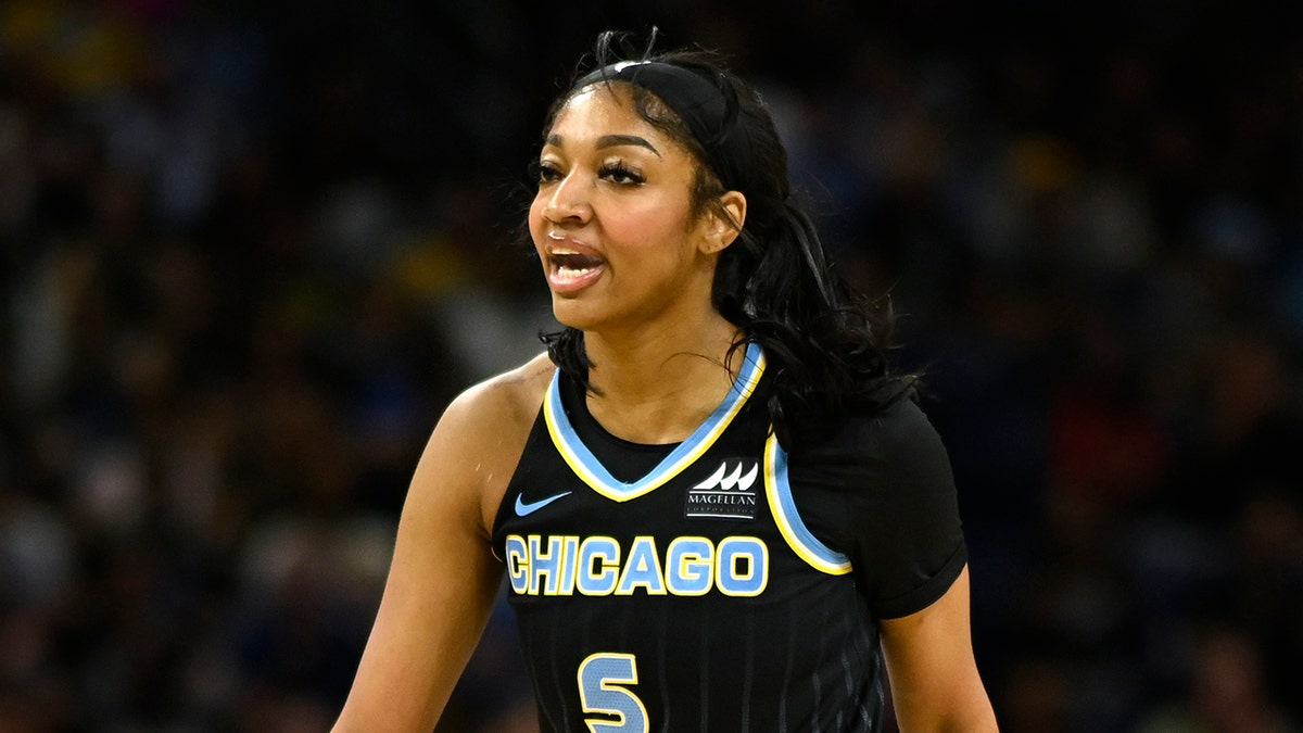 Angel Reese talks on court