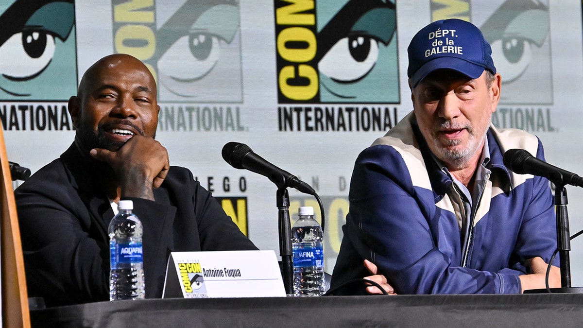 Antoine Fuqua and Roland Emmerich sitting at a table at Comic Con