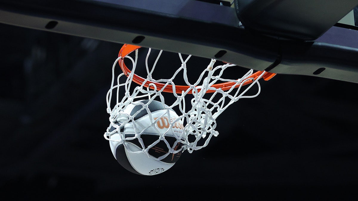 Basketball goes through hoop