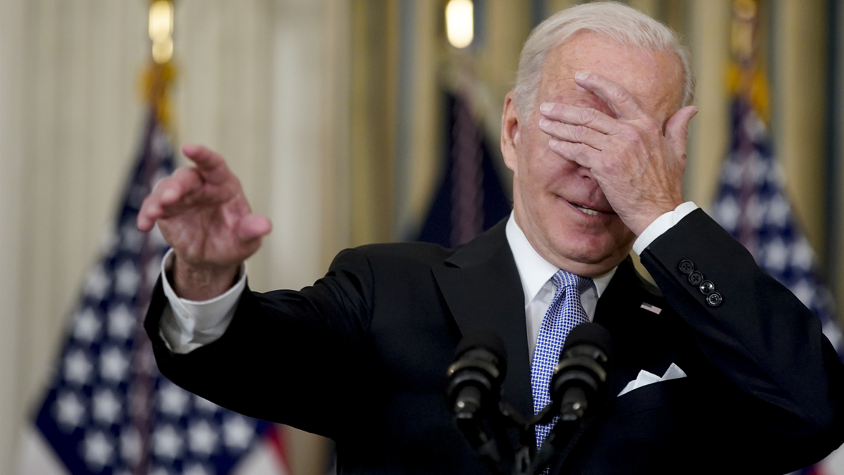 Biden covers his eyes