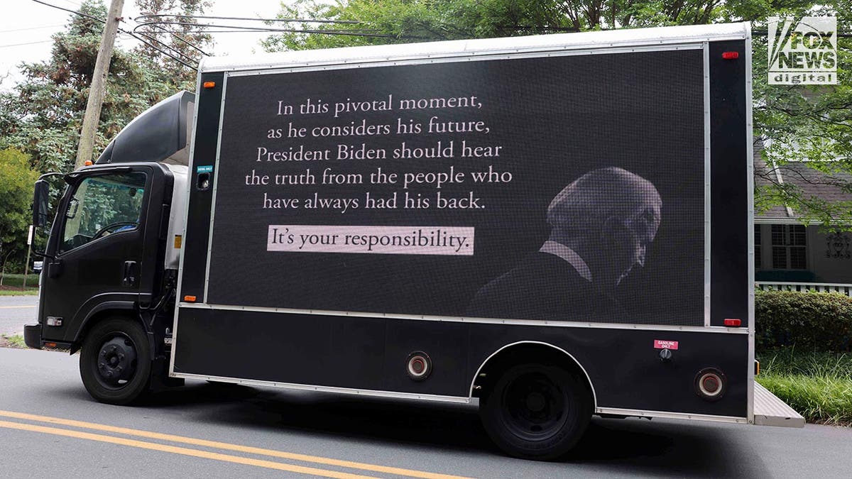 A mobile advertising truck infers that President Biden should resign
