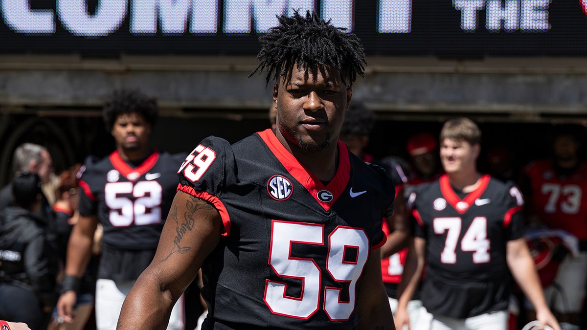 Bo Hughley walks on field