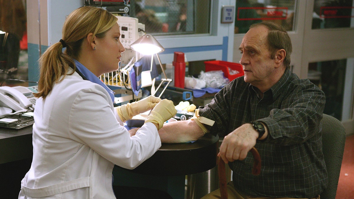 Sherri Stringfield and Bob Newhart in a scene from ER