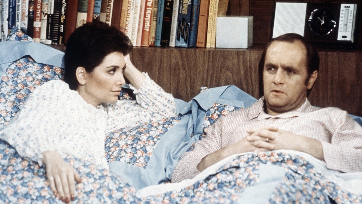 Suzanne Pleshette and Bob Newhart in bed in a scene from The Bob Newhart Show