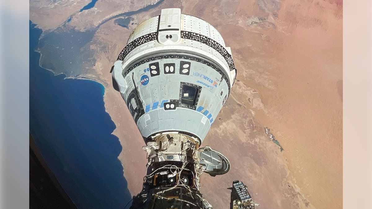 The balloon-shaped Starliner spacecraft is docked to the Harmony module of the International Space Station high above Egypt's Mediterranean coast.