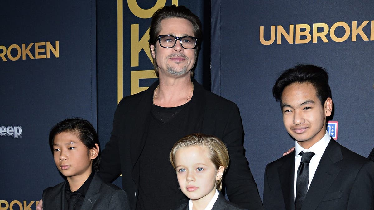 Actor Brad Pitt and children Pax Jolie-Pitt (L), Shiloh Jolie-Pitt (C) and Maddox Jolie-Pitt posing together