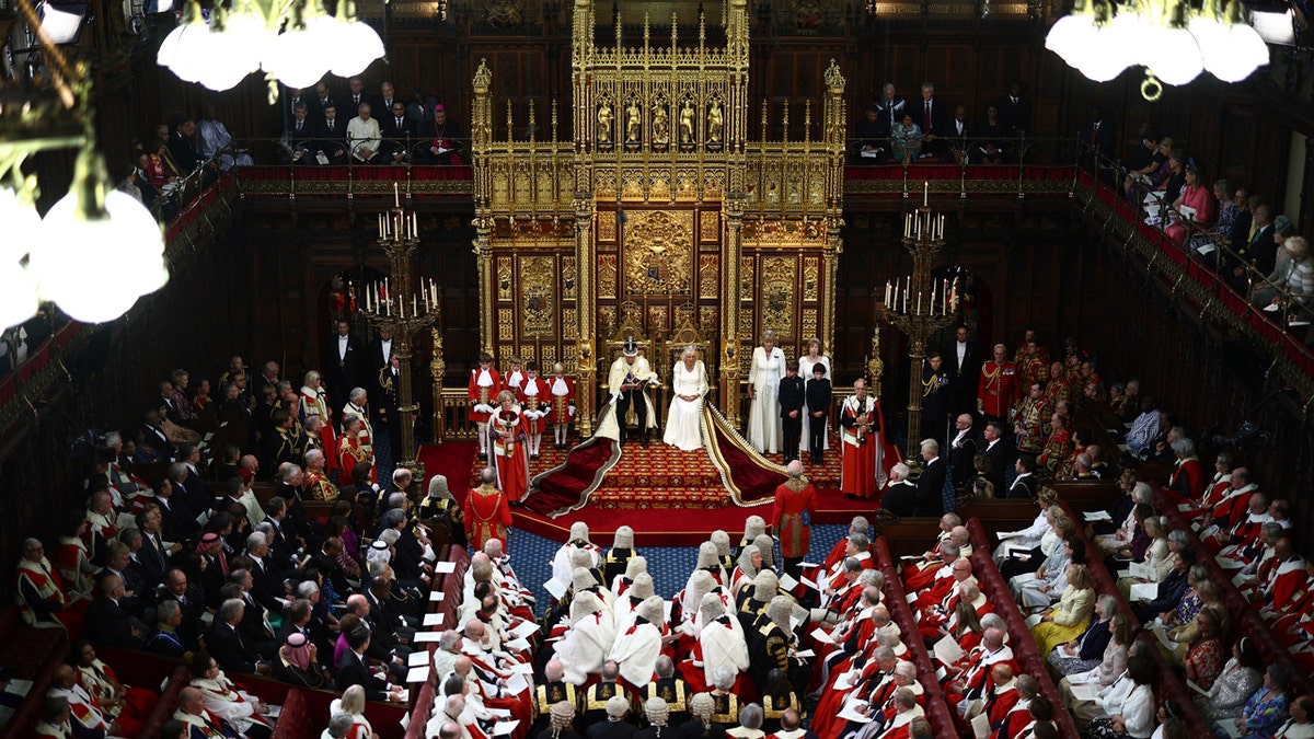 Britain's King Charles III sits alongside Britain's Queen Camilla as he reads the King's Speech.