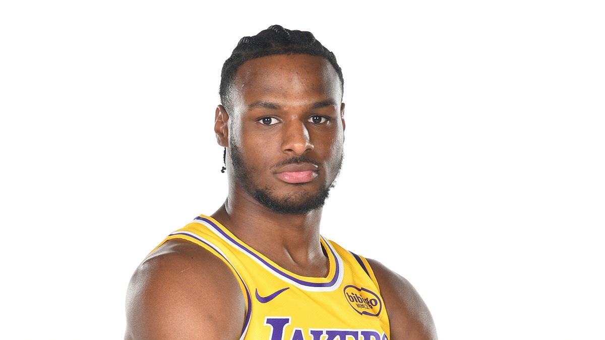 Bronny James poses in Lakers jersey