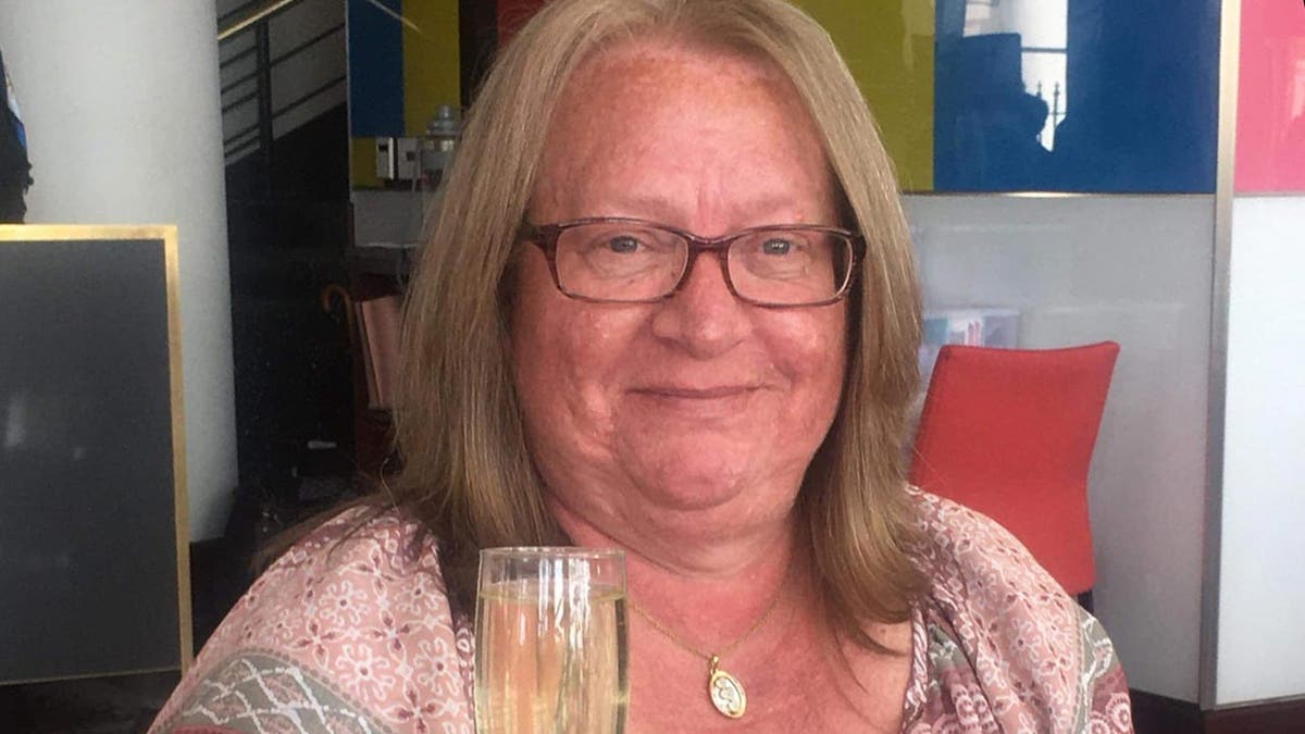 Grandma smiles at the camera in a restaurant