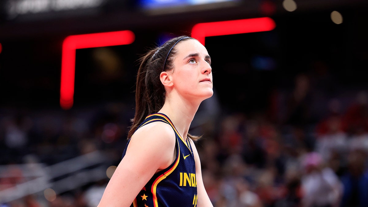 Caitlin Clark looks on during a game