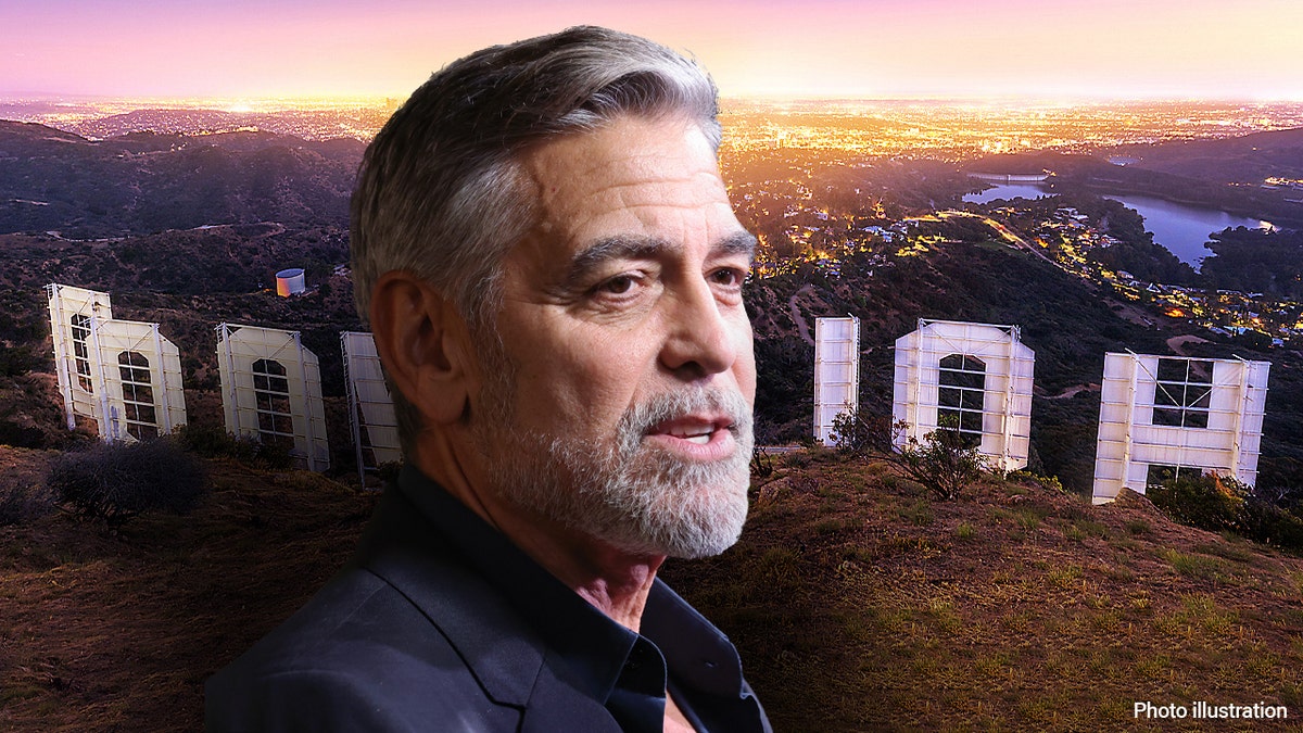 George Clooney in front of the Hollywood sign