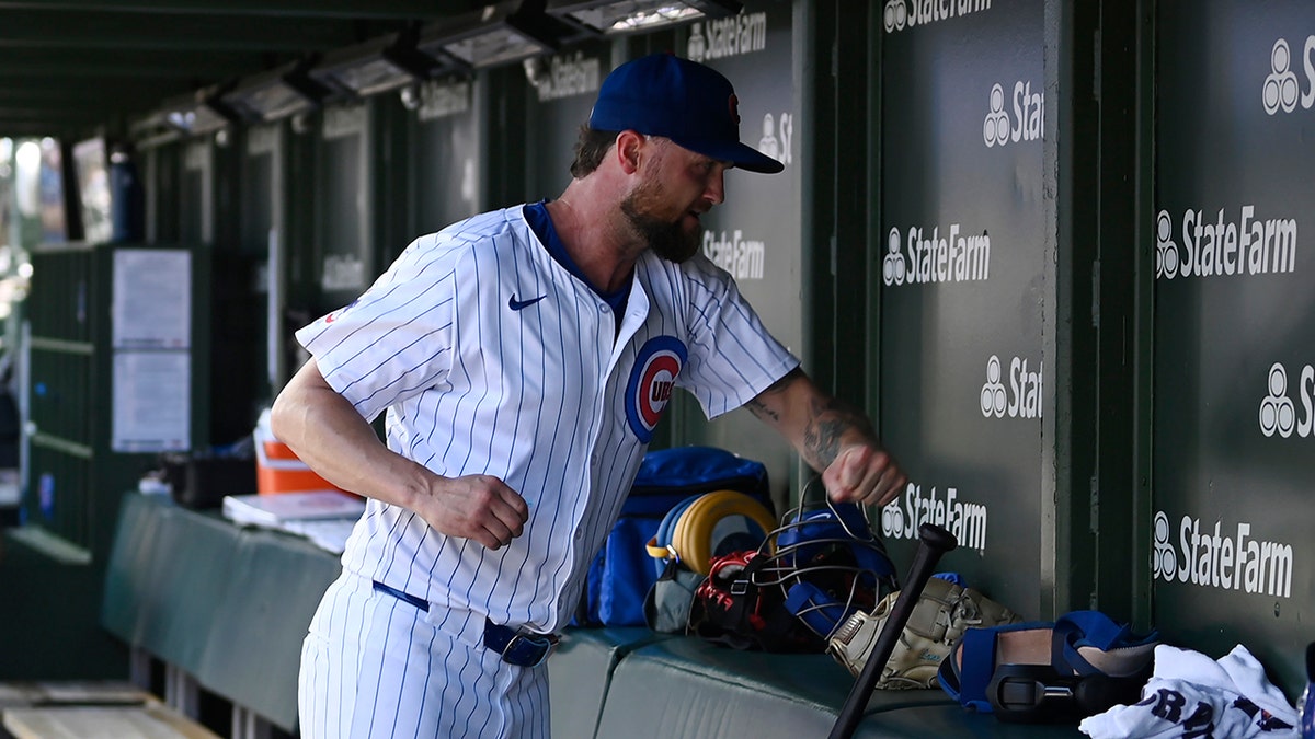 Colten Brewer hits the dugout wall