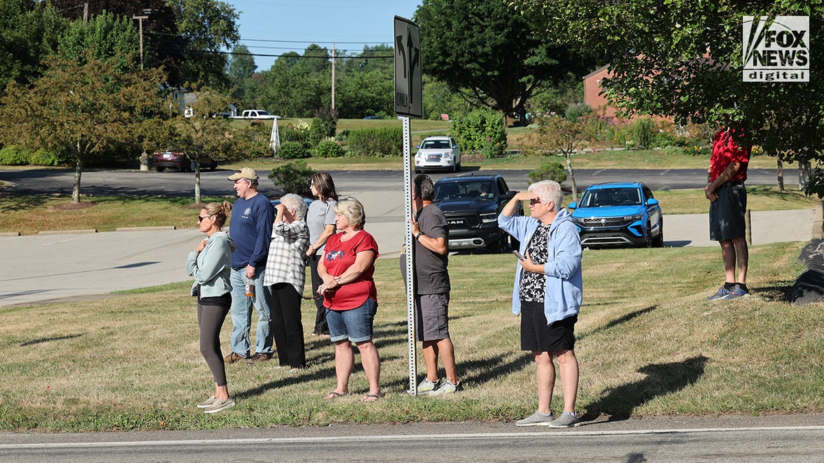 Members of the community mourn the death of Corey Comperatore on the morning of his funeral at Cabot United Methodist Church