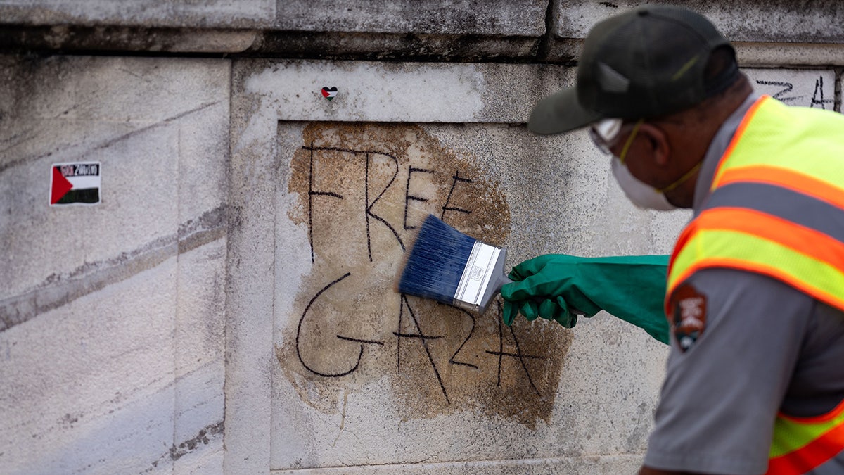 NPS worker cleaning up 'Free Gaza" graffiti 