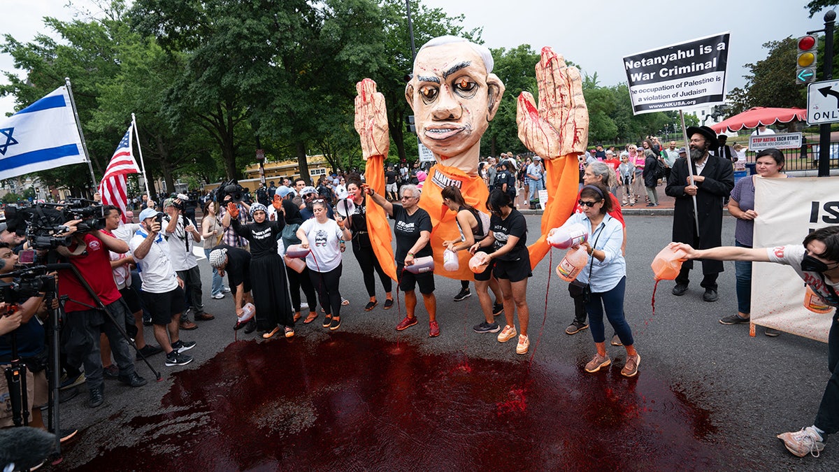 Pro-Palestinian demonstrators with an effigy Israeli Prime Minister Benjamin Netanyahu protest in front of the White House