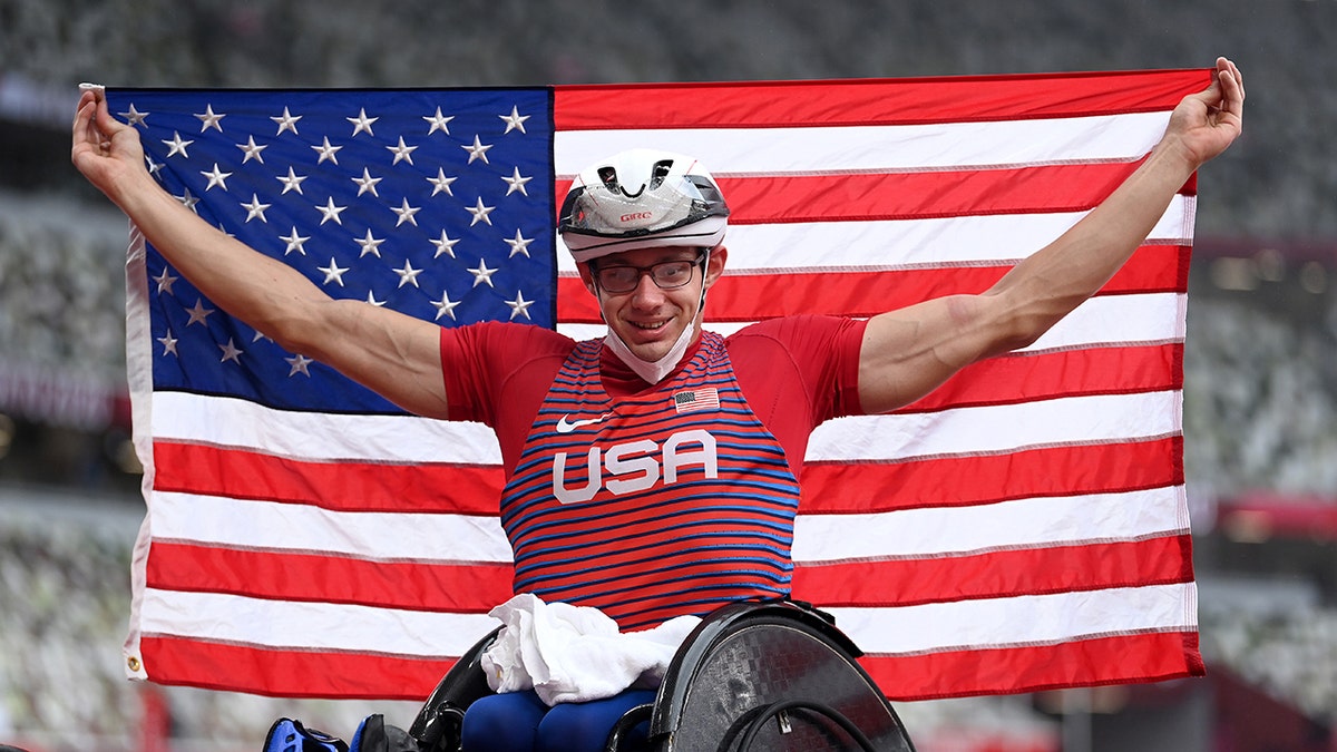 Daniel Romanchuk holds the American flag