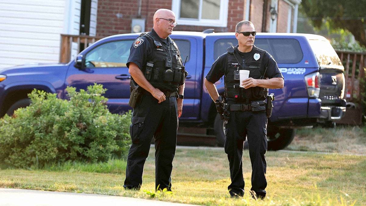 Bethel Park police officers talk outside the home of 20-year-old Thomas Matthew Crooks