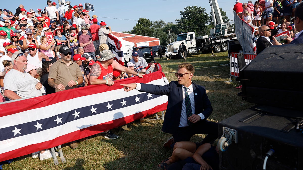 A Secret Service member and the crowd is seen at republican presidential candidate former President Donald Trump's rally