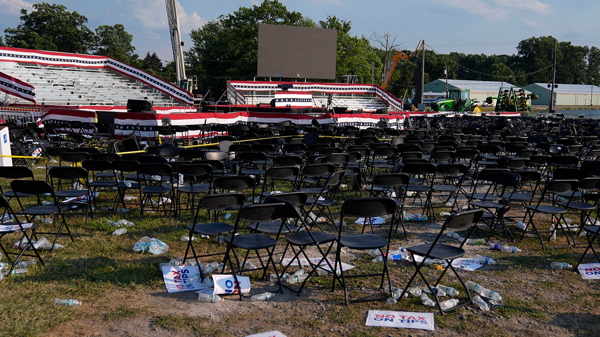 A campaign rally site for Republican presidential candidate former President Donald Trump is empty and littered with debris