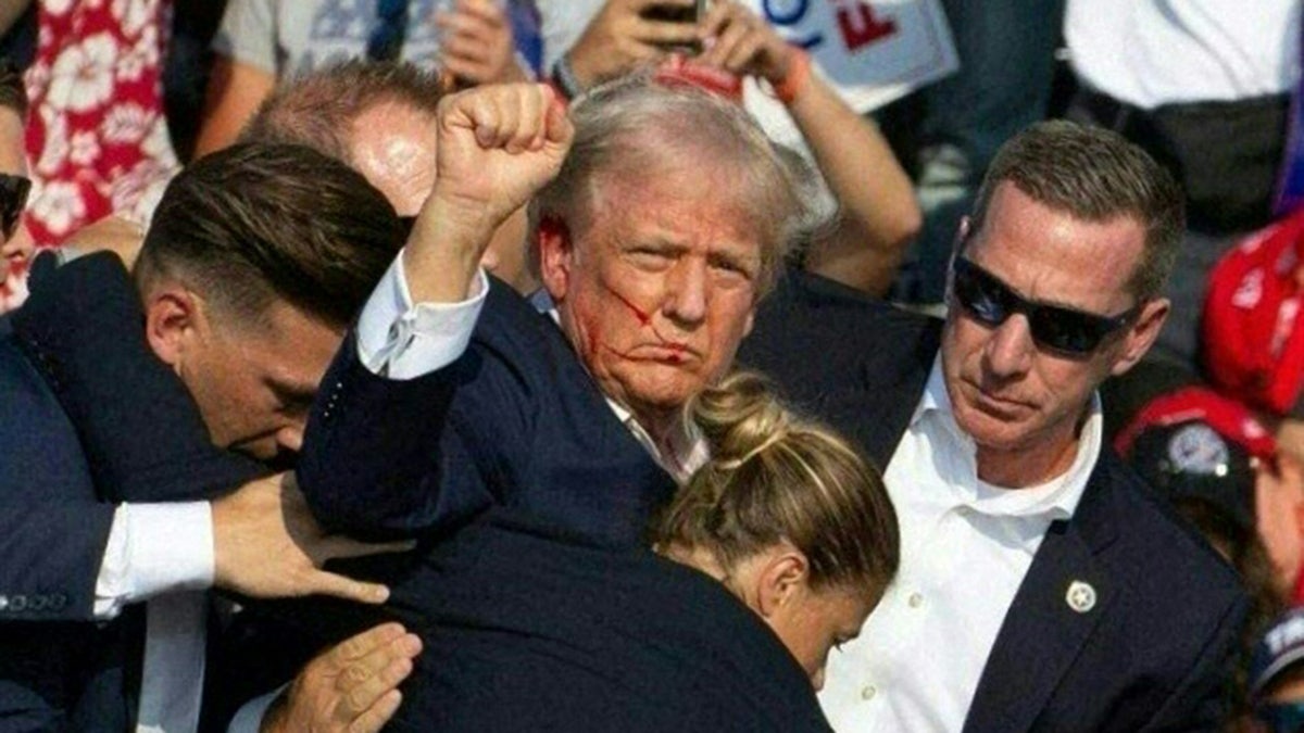 Trump holds his fist