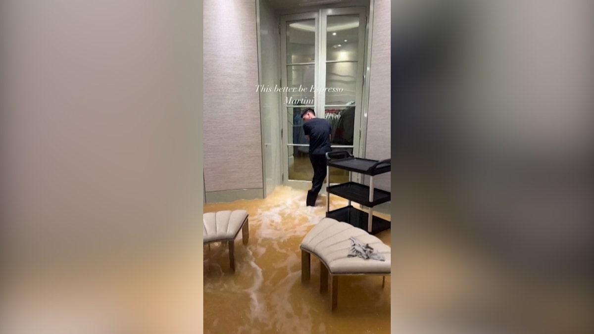 Text reads 'This better be Espresso Martini" over a still image from rapper Drake's Instagram post showing brown water rushing into the singer's mansion.