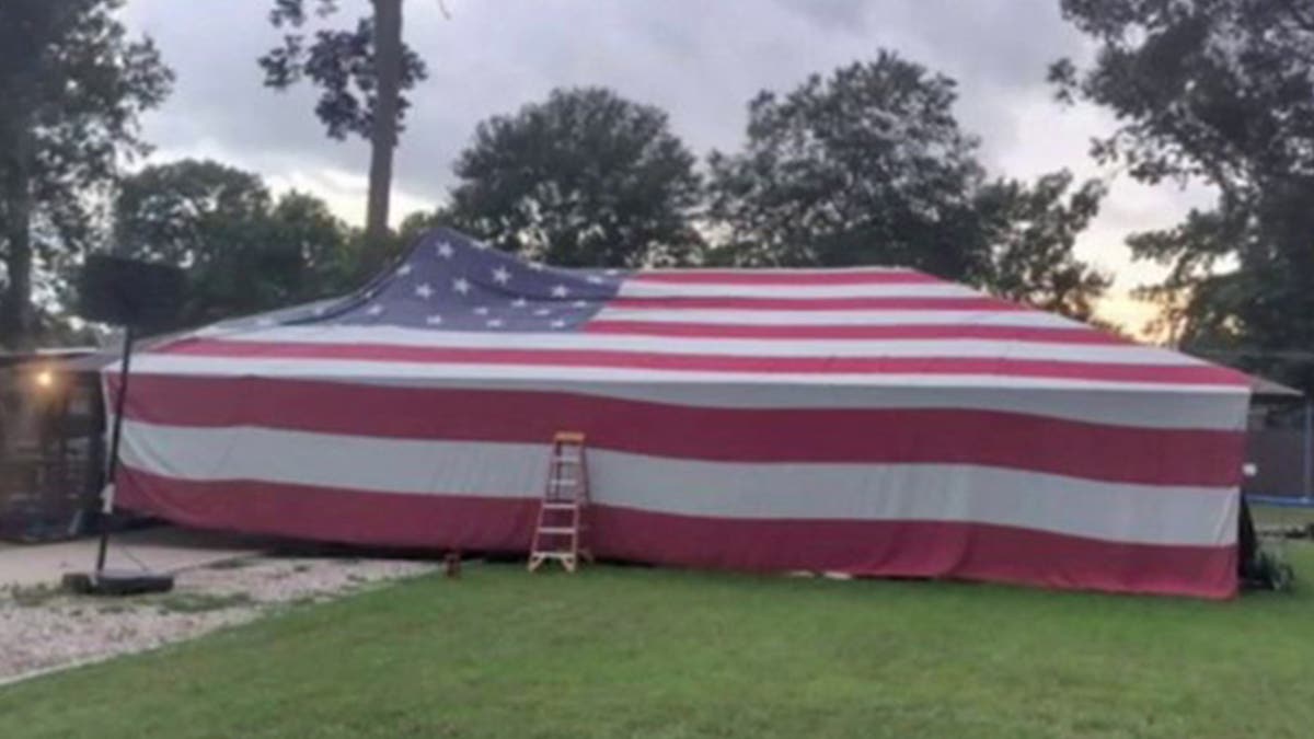 Beard family home draped in American flag