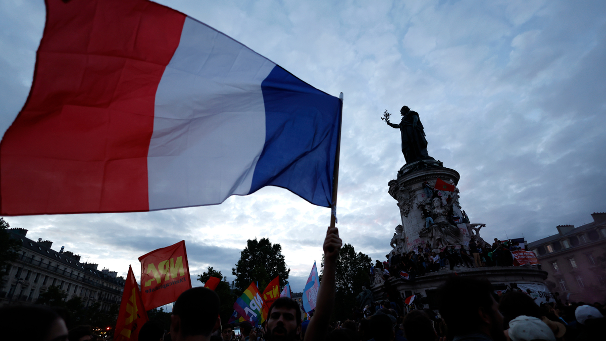 People gather on the Republique plaza