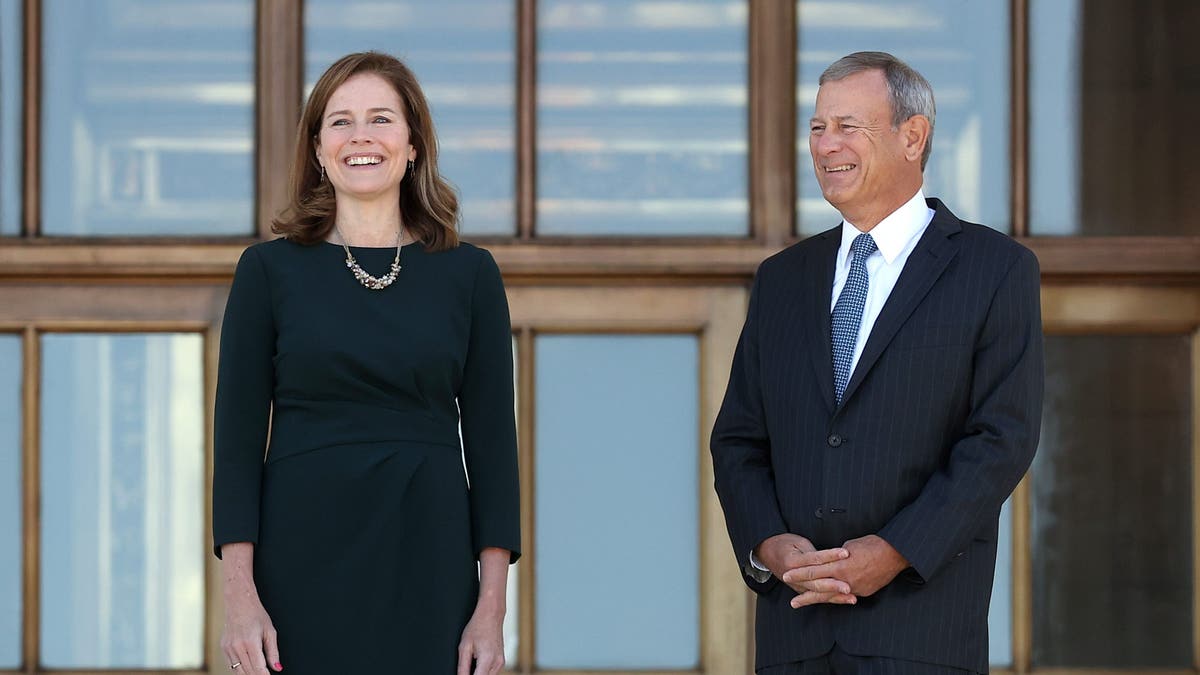 Justice Barrett, left, with Chief Justice Roberts outside Supreme Court 