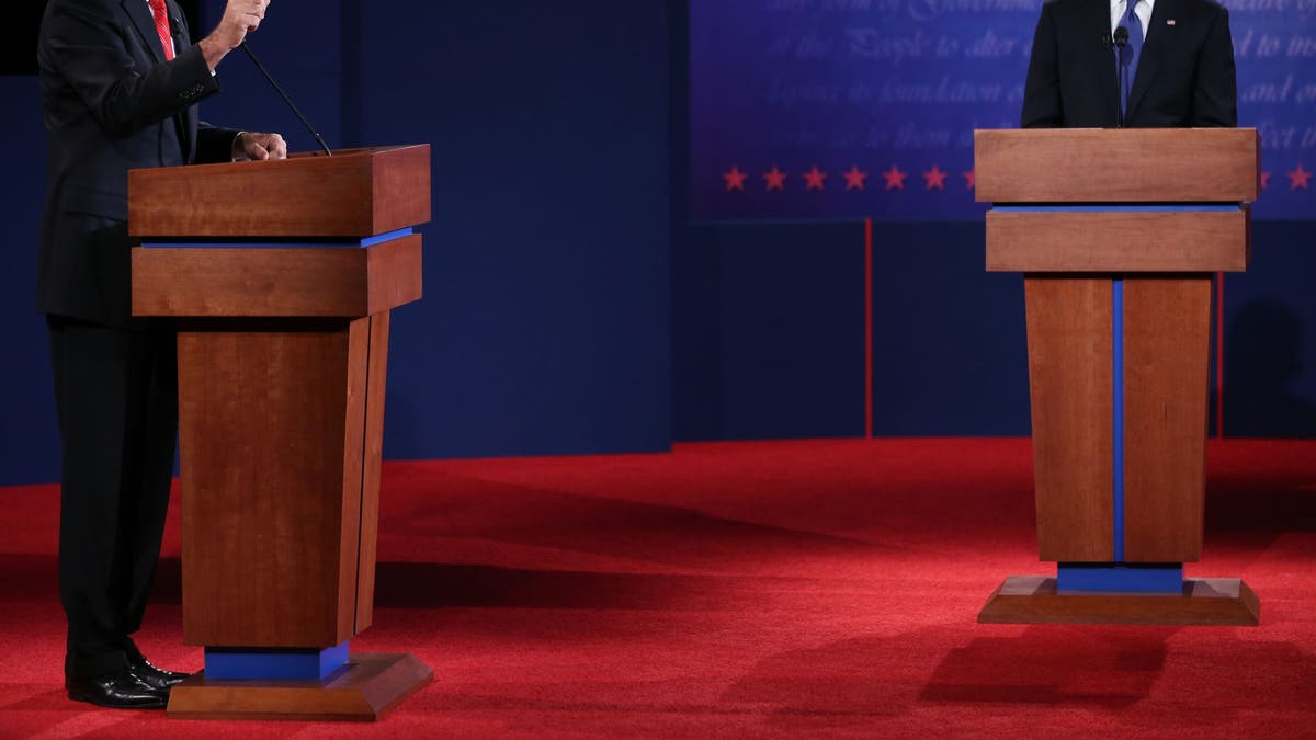 Mitt Romney, left, and Barack Obama, right, on the debate stage