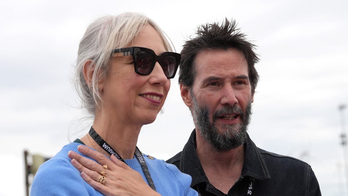 Alexandra Grant and Keanu Reeves smiling