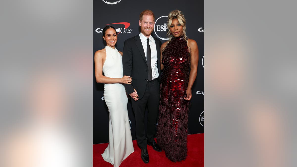 harry, meghan and serena williams on the red carpet