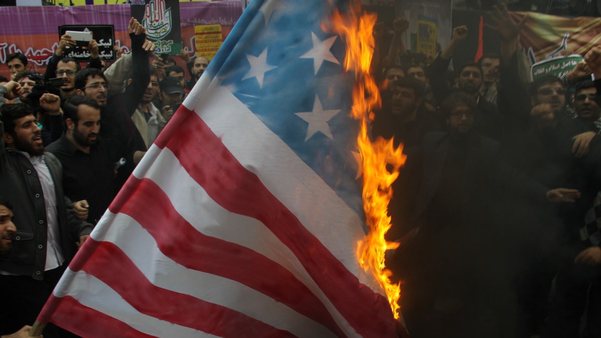 Iranians burn US flag