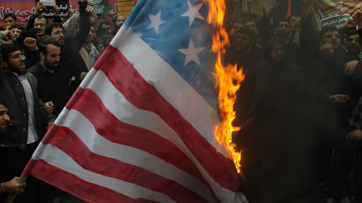 Iranians burn US flag