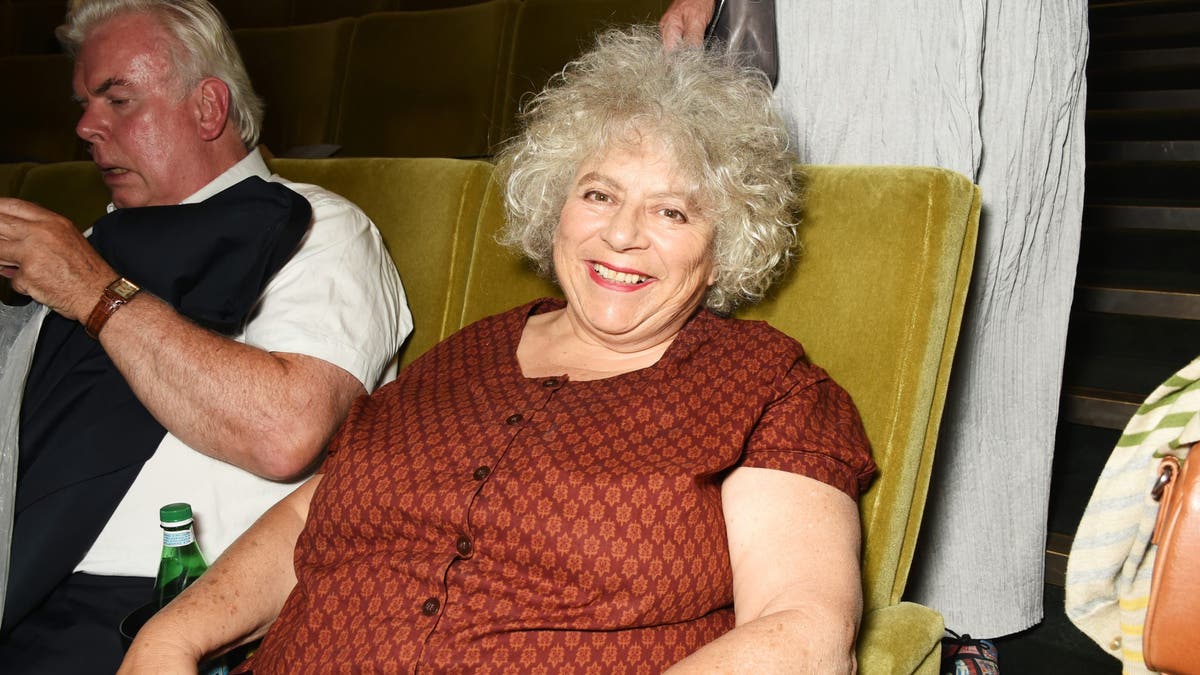 Miriam Margolyes sitting