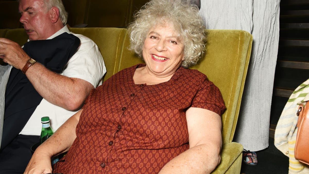 Miriam Margolyes sitting