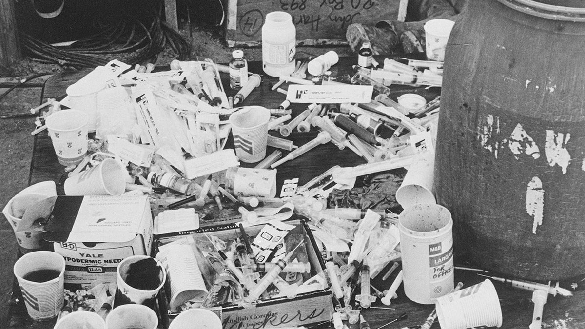 A pile of cups and needles in Jonestown.