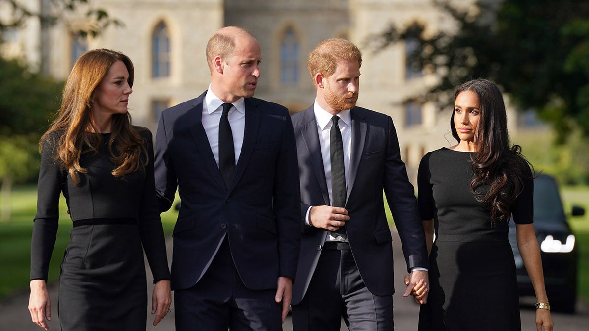The British royals all walking together wearing black.