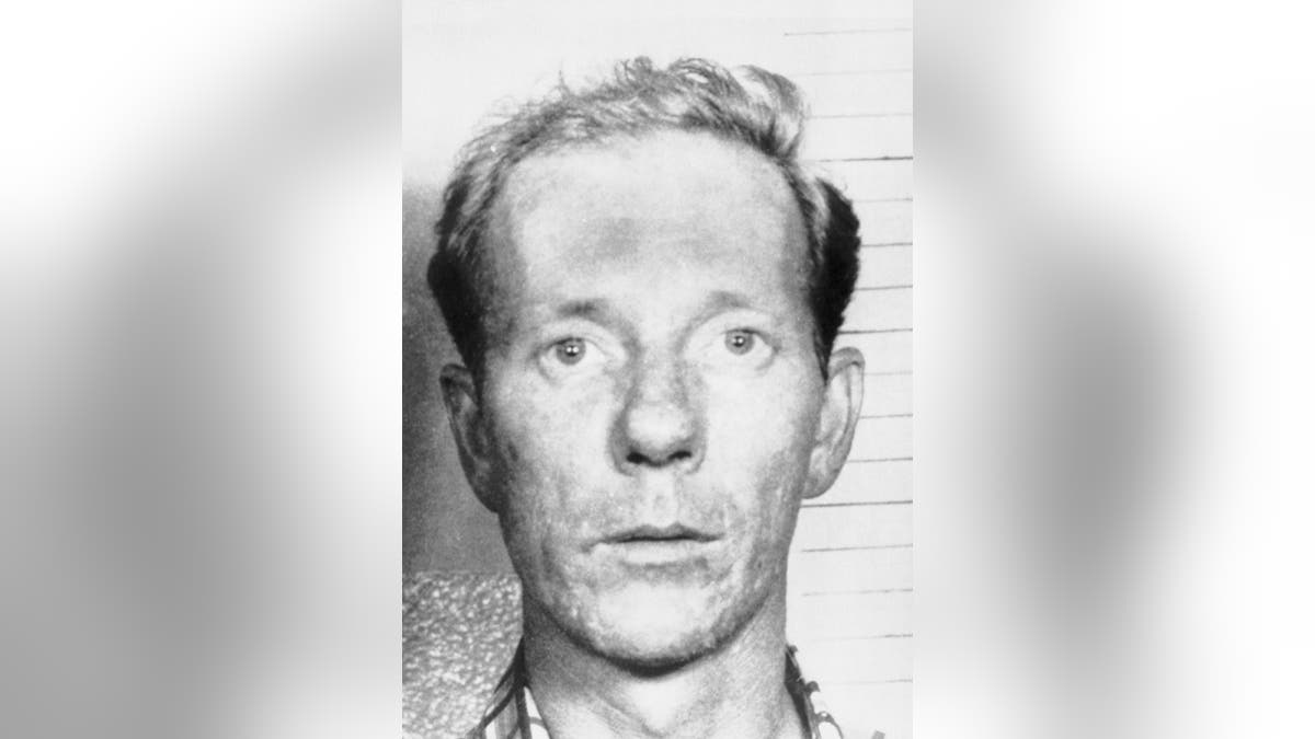 A close-up mugshot of Robert F. Carr