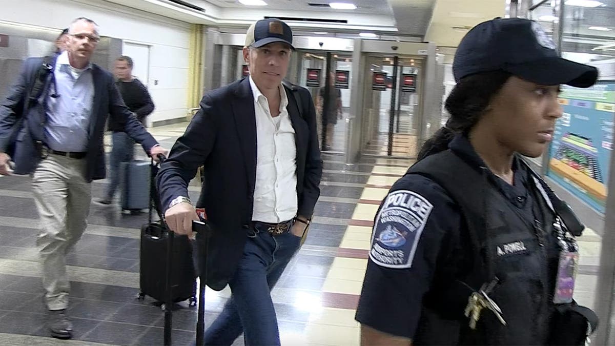 Hunter Biden arrives at Reagan National Airport in Arlington, Virginia, on Tuesday. The son of President Biden flew in from California as Biden returns to the White House for the first time since rescinding the Democratic Party nomination for president.