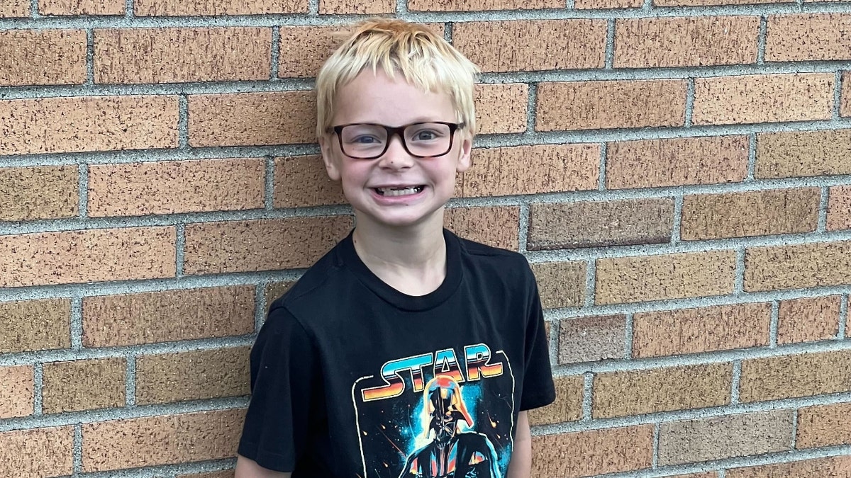 Nicholas poses in a Star Wars t-shirt