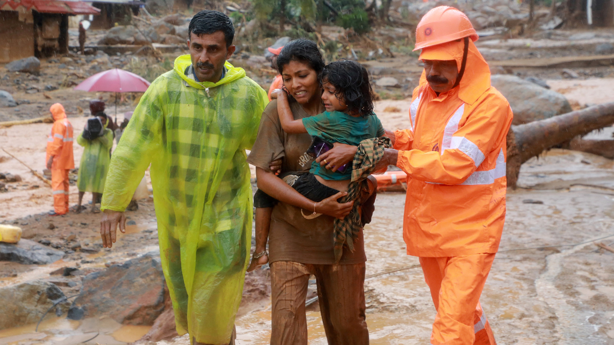 Rescuers help residents